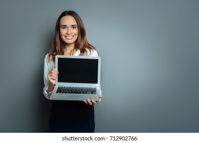 Delighted Nice Woman Showing You Her Laptop