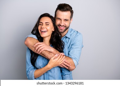 Delighted! Portrait of funky beautiful childish excited fellows cuddling each other enjoying placing arms around neck chest laughing dressed in blue denim outfit isolated on silver background - Shutterstock ID 1343296181