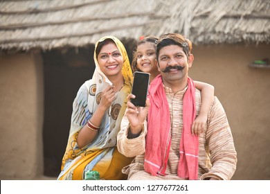 Delighted Rural Family Holding New Mobile Phone