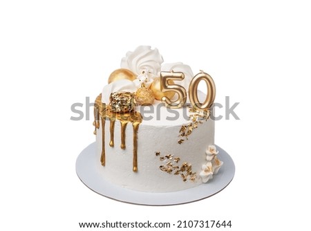 A delightful decorated white and gold cream cake for a fiftieth anniversary. On a white background close-up.