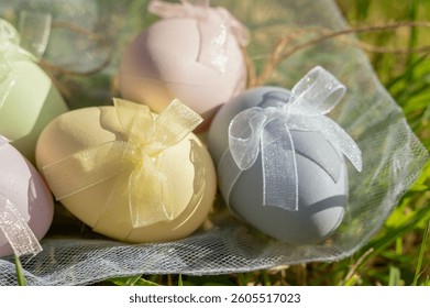 Delightful pastelcolored Easter eggs beautifully adorned with ribbons and bows, perfect for enhancing spring decor