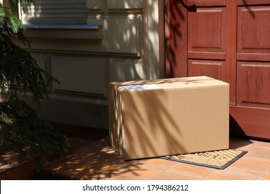 Delivered Parcel On Door Mat Near Entrance