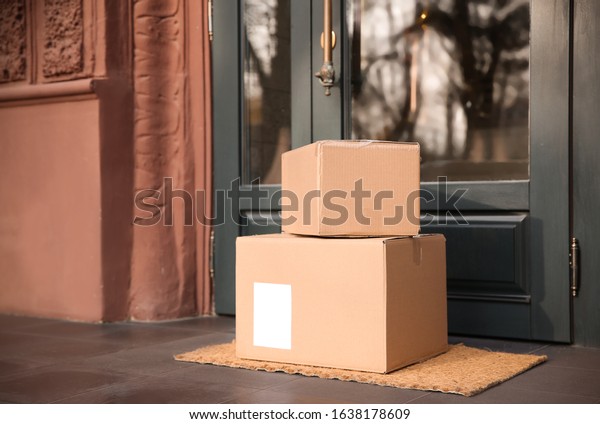 Delivered parcels on\
door mat near\
entrance
