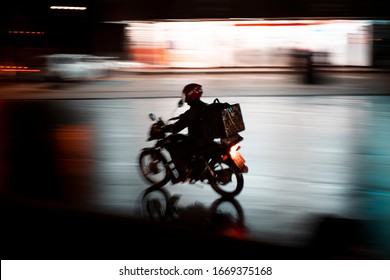 Delivery Bike On A Rainy Night