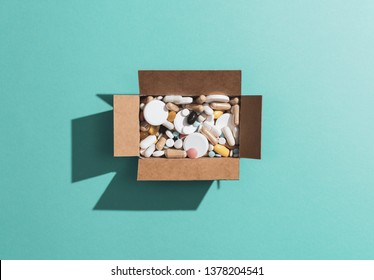 Delivery Box Filled With Assorted Prescription Medicines And Drugs: Self Medication, Addiction And Drug Abuse Concept