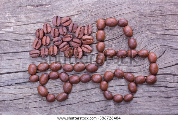 delivery car of coffee beans from coffee beans on\
old wooden table