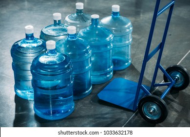 Delivery cart placed by water bottles