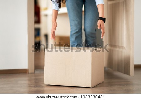 Similar – Image, Stock Photo Unrecognizable woman packing carton box with tape dispenser