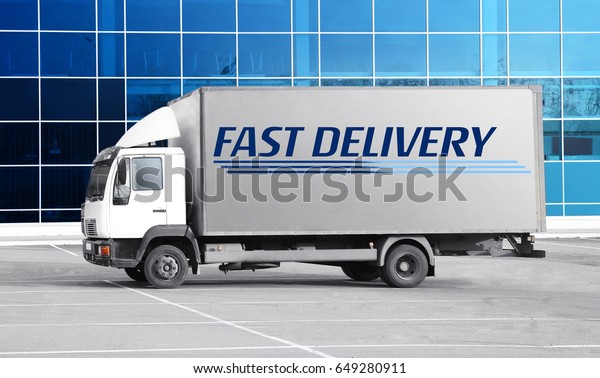 Delivery concept.\
Service truck at parking\
lot