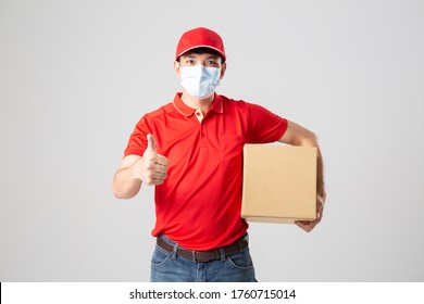 Delivery Concept - Set Of Portrait Of Asian Delivery Man With Face Mask In Red Cloth Holding A Box Package.