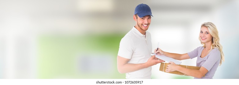 Delivery Courier with client forms in front of blurred background - Shutterstock ID 1072635917