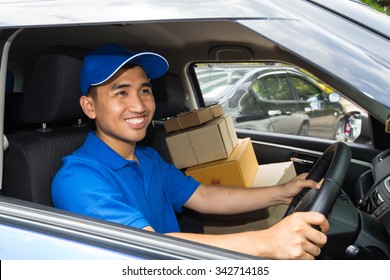 Delivery Driver Driving With Parcels On Seat