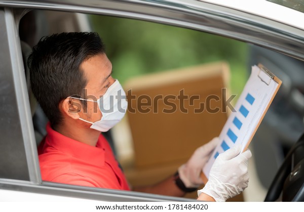 Delivery driver\
driving van Package To\
House