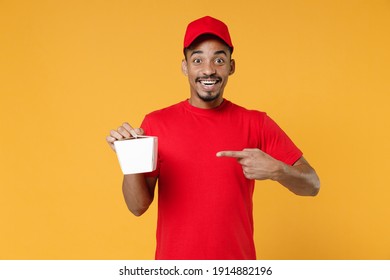 Delivery Employee African Man 20s In Red Cap Blank Print T-shirt Uniform Work Courier Service Concept Hold Chinese Food Cuisine And Takeaway Carton Container Box Isolated On Yellow Background Studio