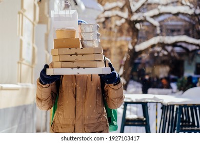 Delivery Employee Man At Thermal Takeaway Food Bag Backpack Pizza Boxes Work Courier Service Concept. Outdoor Winter Portrait.