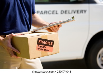 Delivery: Focus On Cardboard Box With Label