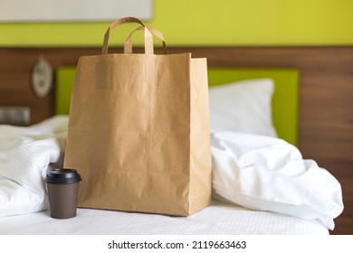 Delivery Food Craft Bag With Cup On The Bed On Sunny Day. Delivery In Any Weather Around The Clock To The Client. Fast Food Eco Packaging With Big Breakfast Set