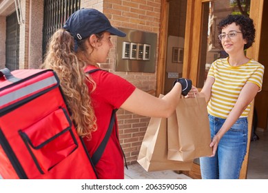 A Delivery Girl Delivers Bags Of Food On The Street