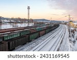 Delivery of goods by rail. Top view of freight railway cars. Freight trains with coal and cargo. Transport infrastructure and cargo transportation. Baikal-Amur Mainline (BAM), Eastern Siberia, Russia.