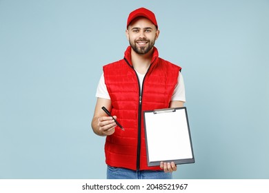 Delivery guy employee man in red cap white T-shirt vest uniform workwear work as dealer courier hold clipboard with papers document for sign isolated on blue color background studio. Service concept