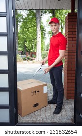 Delivery Guy Leaving A Large Package At Doorstep