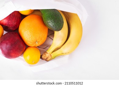 Delivery Healthy Food Background. Vegan Vegetarian Food In Fabric Bag Fruits On White, Copy Space, Banner. Grocery Shopping Food Supermarket And Clean Eating. Zero Waste Concept. No Plastic