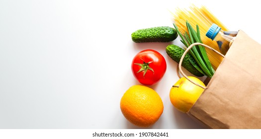 Delivery Healthy Food. Fresh Vegetables And Fruits In Paper Shopping Bag On The Table. Top View. Copy Space. Banner.