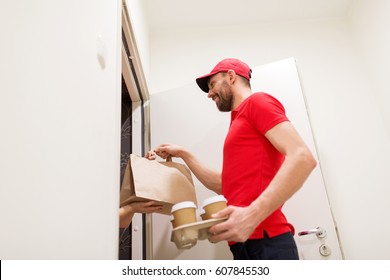 Delivery, Mail And People Concept - Happy Man Delivering Coffee And Food In Disposable Paper Bag To Customer Home