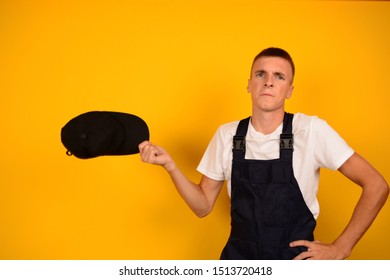 Delivery Man With A Cap On A Yellow Background Post Emotions Place Free Loader Courier