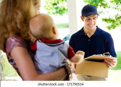 Delivery: Man Checking Clipboard For Address Confirmation - Powered by Shutterstock