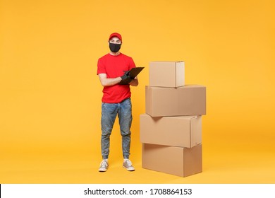 Delivery Man Employee In Red Cap Blank Tshirt Uniform Face Mask Glove Hold Empty Cardboard Box Isolated On Yellow Background Studio Service Quarantine Pandemic Coronavirus Flu Virus 2019-ncov Concept