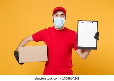 Delivery Man Employee In Red Cap Blank T-shirt Uniform Face Mask Gloves Hold Empty Cardboard Box Isolated On Yellow Background Studio Service Quarantine Pandemic Coronavirus Virus 2019-ncov Concept