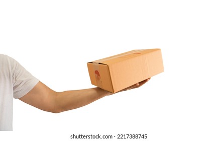 Delivery Man Hand Holding Parcel Cardboard Box Isolated On White Background. Online Shopping And Delivery Transport 