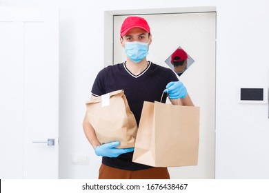 Delivery Man Holding Paper Bag With Food On White Background, Food Delivery Man In Protective Mask And Protective Gloves