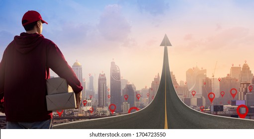 Delivery Man Holding Parcel Boxes On Road Turning Into An Arrow Rising Upward On Map Pin Location.Online Shopping And Express Delivery Concept.in The Future As A Symbol Of Business Vision.