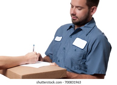 Delivery man holding a parcel while woman putting signature in clipboar.  Courier service concept