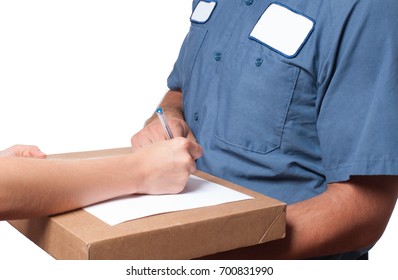 Delivery man holding a parcel while woman putting signature in clipboar.  Courier service concept