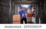 Delivery Man Loading Van In Logistics Warehouse