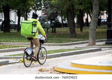 Delivery Man On The Bike In The City Roadway