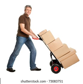 Delivery Man Pushing Hand Truck And Stack Of Boxes