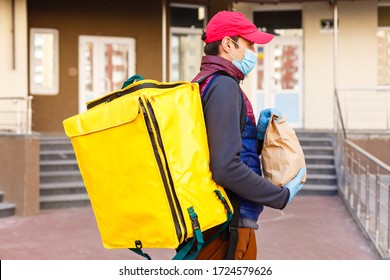 Delivery Man Send Food Bag For Contactless Or Contact Free From Delivery Rider In Front House For Social Distancing For Infection Risk.