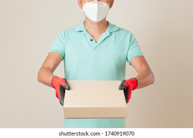 delivery man in t-shirt, standing hold boxes with fast food being carried for one of clients. - Shutterstock ID 1740919070