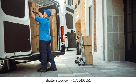 Delivery Man Uses Hand Truck Trolley Full of Cardboard Boxes and Packages, Loads Parcels into Truck / Van. Professional Courier / Loader helping you Move, Delivering Your Purchased Items Efficiently