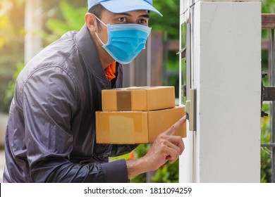 Delivery Man Wear Hygienic Mask And Blue Cap Pushing Bell And Holding Cardboard Box With Look To Customer For Receive Goods,light Leak Style