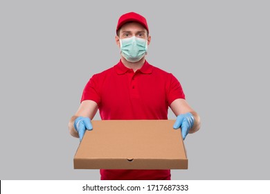 Delivery Man Wearing Medical Mask And Gloves With Pizza Box. Yellow Tshirt Delivery Boy.