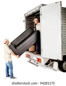 Delivery Men With Unloading A Sofa From A Truck - Isolated Over White