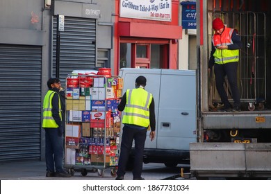 Delivery men unloading the truck in London UK December 2020