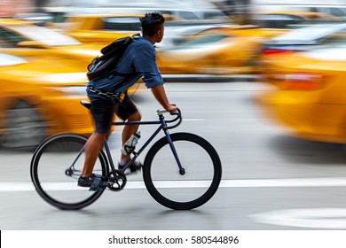 Delivery On The Bike In Traffic On The City Roadway  Motion Blur