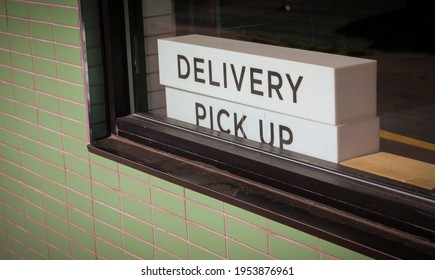 Delivery Pick Up Store Sign During The Historic Covid-19 Coronavirus Pandemic Economic Recovery