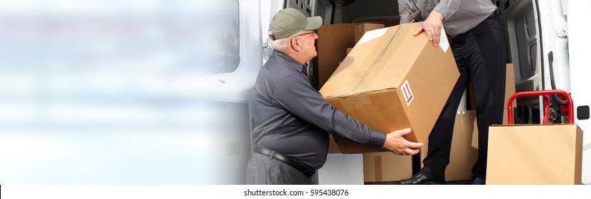 Delivery postman with a box - Shutterstock ID 595438076